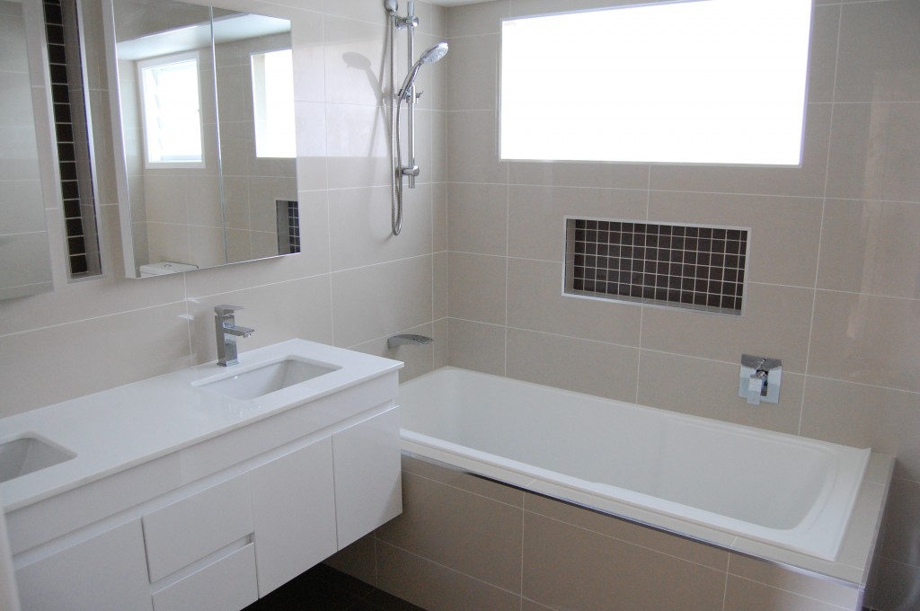 Neutral tone wall tiles in bathroom